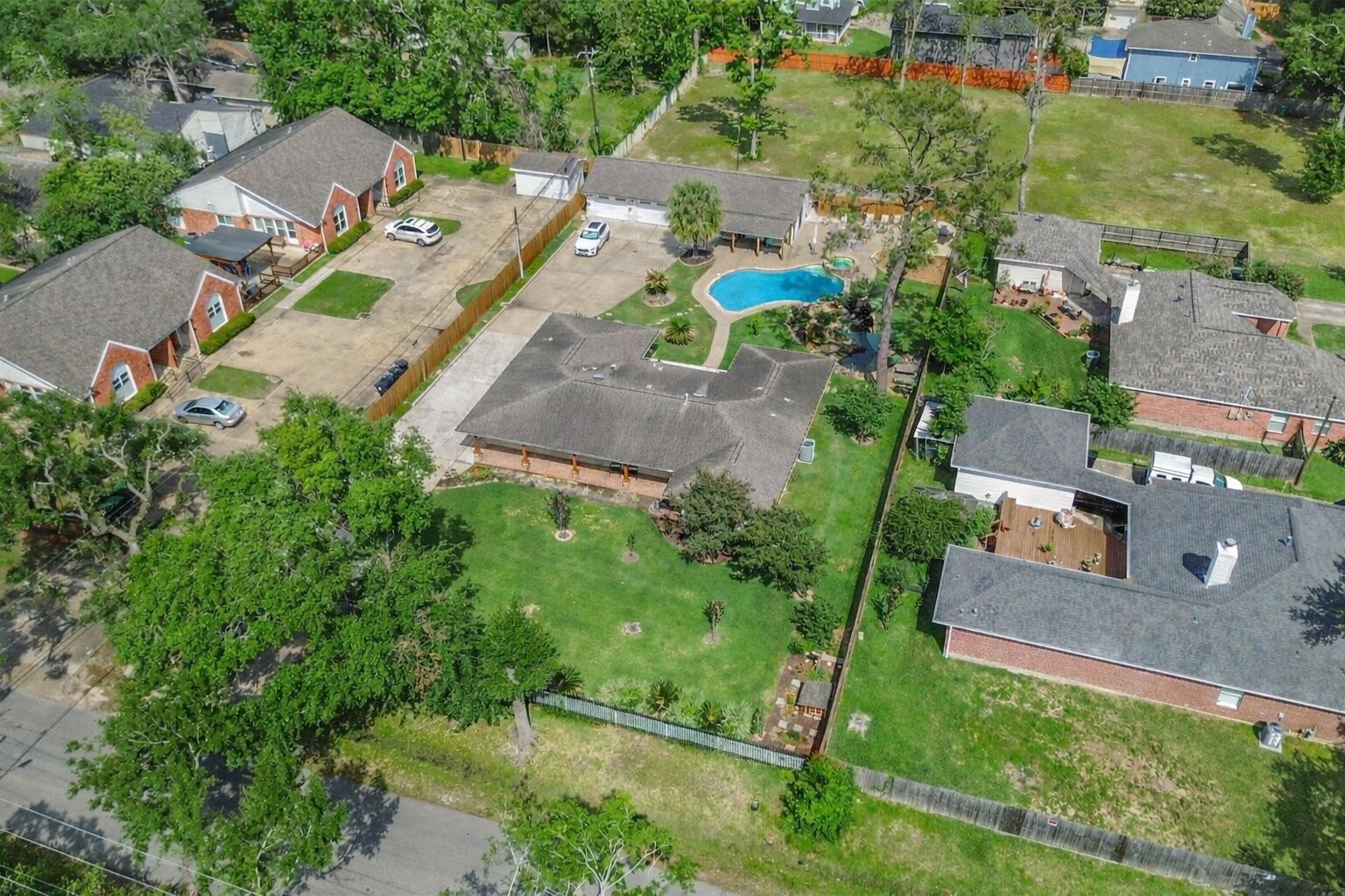 1914 Peppermill Road Houston, TX 77080 - Photo 42 of 49 This angle really shows off your backyard layout—pool, green space, and room to entertain without ever feeling crowded.