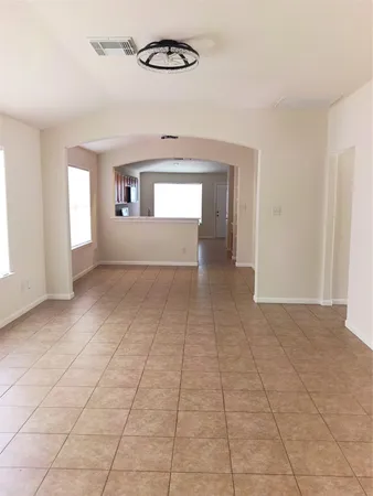 a view of empty room with windows