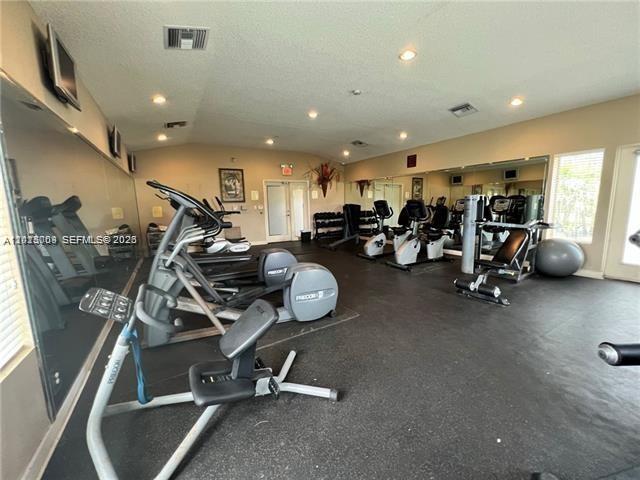 951 Lyons Road, Unit 6206 Coconut Creek, FL 33063 - Photo 11 of 27 a view of a room with gym equipment