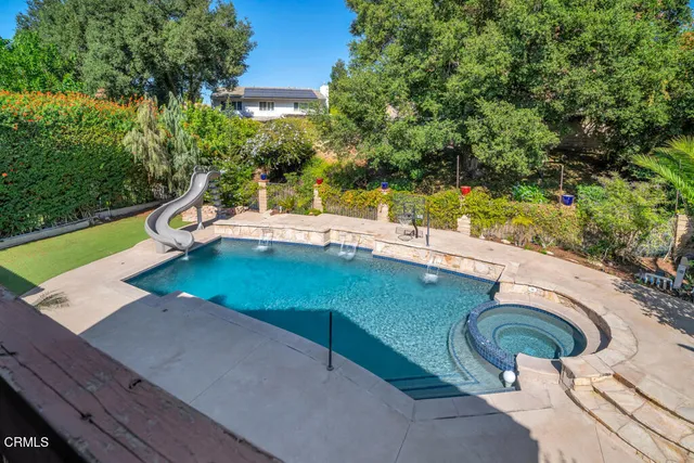 a view of a swimming pool with a patio