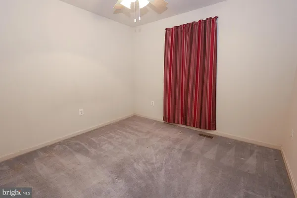 a view of a room with rack on the wall