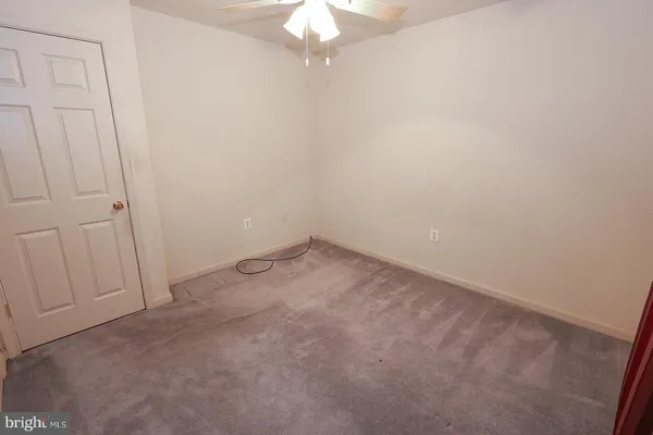 a bathroom with a sink mirror vanity and toilet