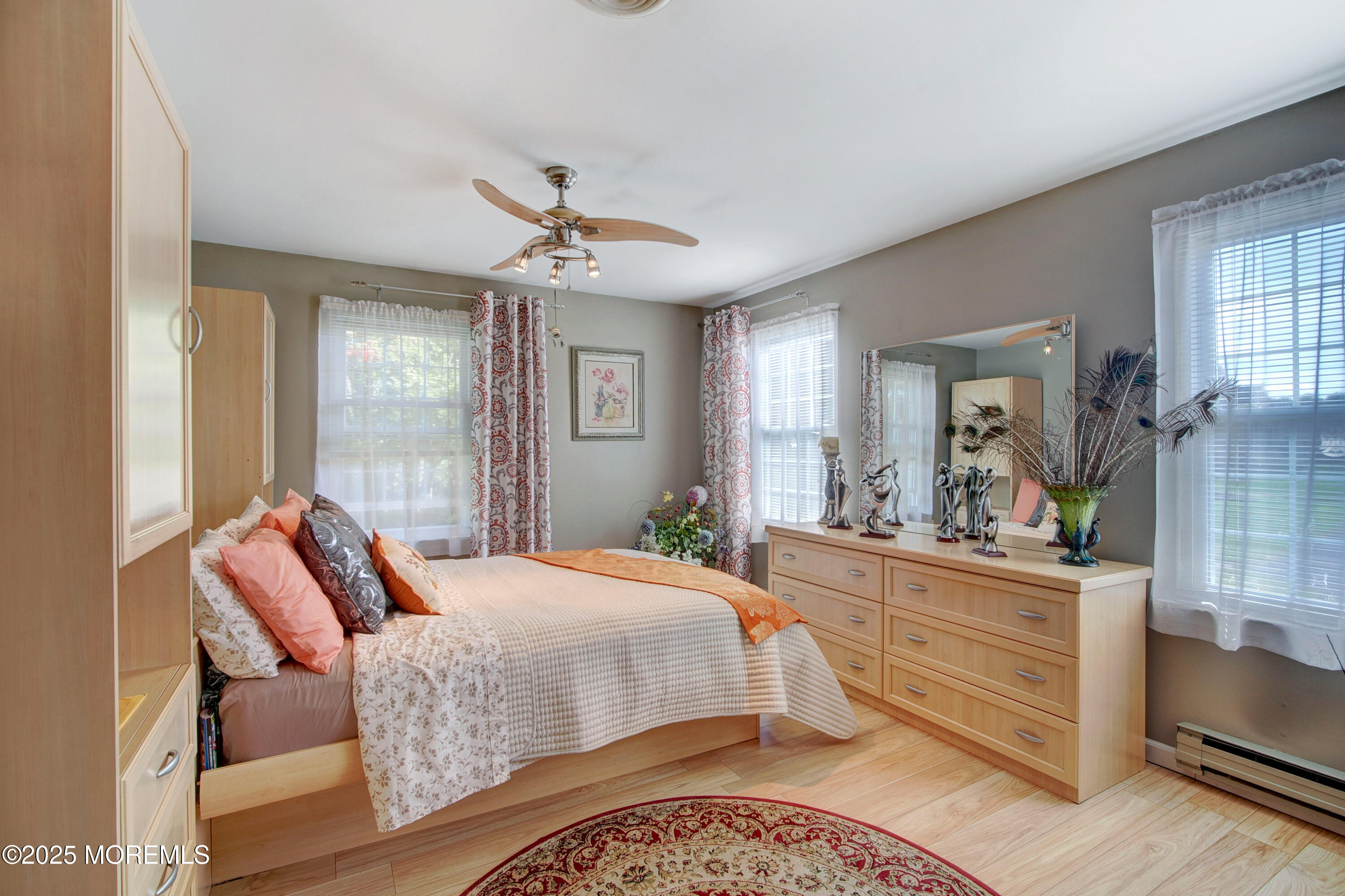 8B Alpine Road, Unit C Whiting, NJ 08759 - Photo 13 of 23 a bedroom with a bed and wooden floor