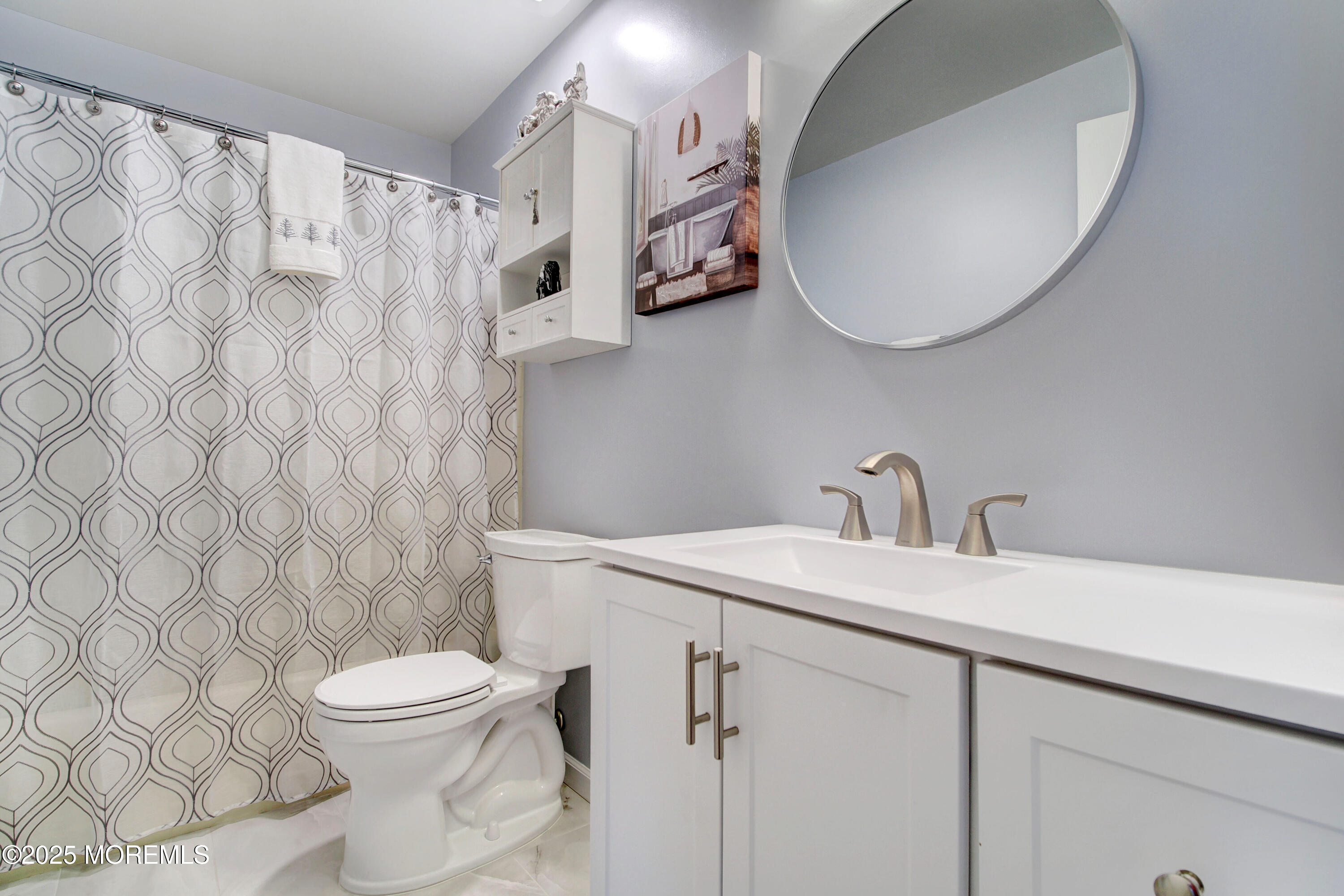 8B Alpine Road, Unit C Whiting, NJ 08759 - Photo 14 of 23 a bathroom with a sink a toilet and a mirror