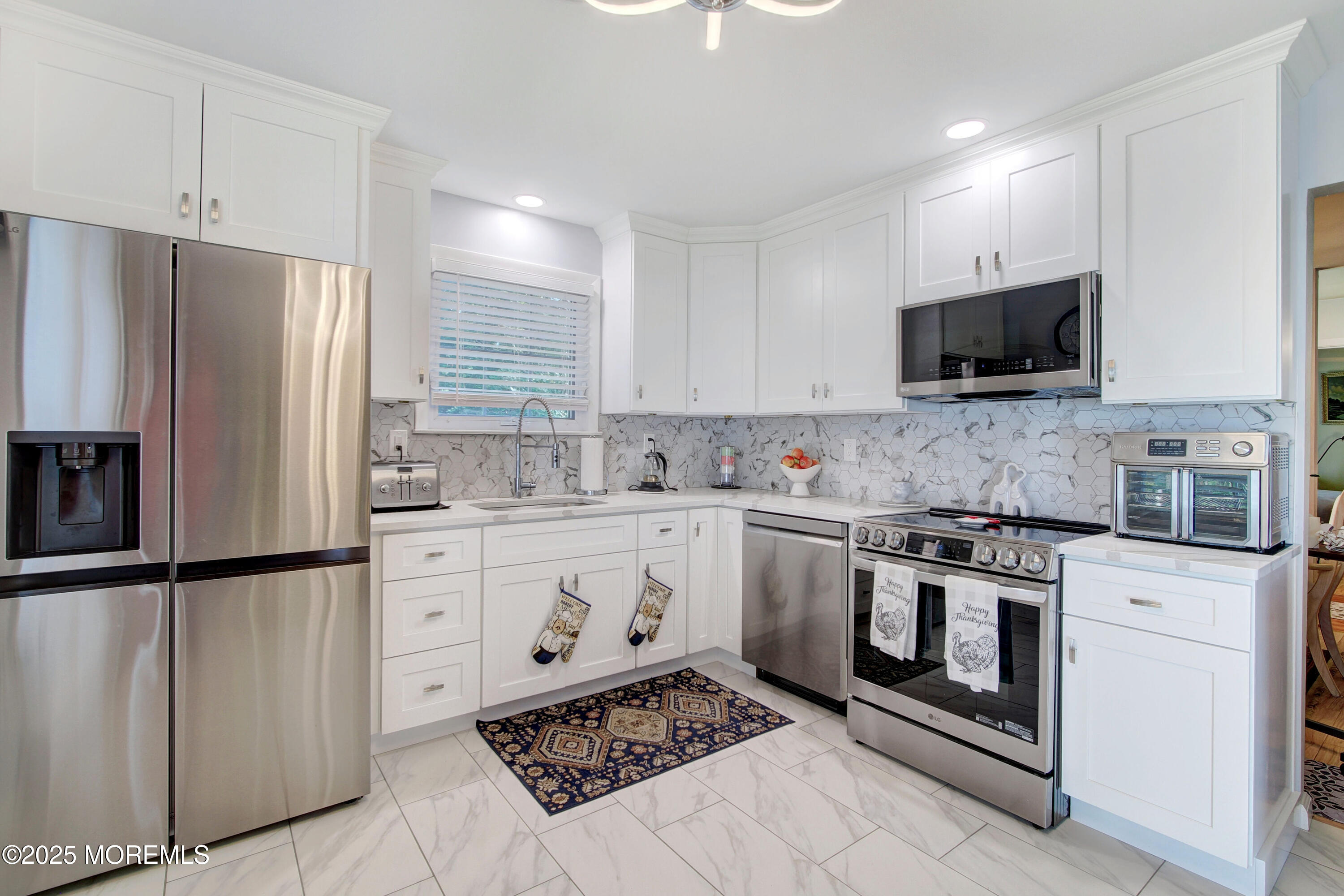 8B Alpine Road, Unit C Whiting, NJ 08759 - Photo 2 of 23 a kitchen with stainless steel appliances granite countertop a stove a sink and a refrigerator