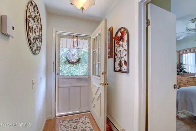 a view of front door with wooden floor