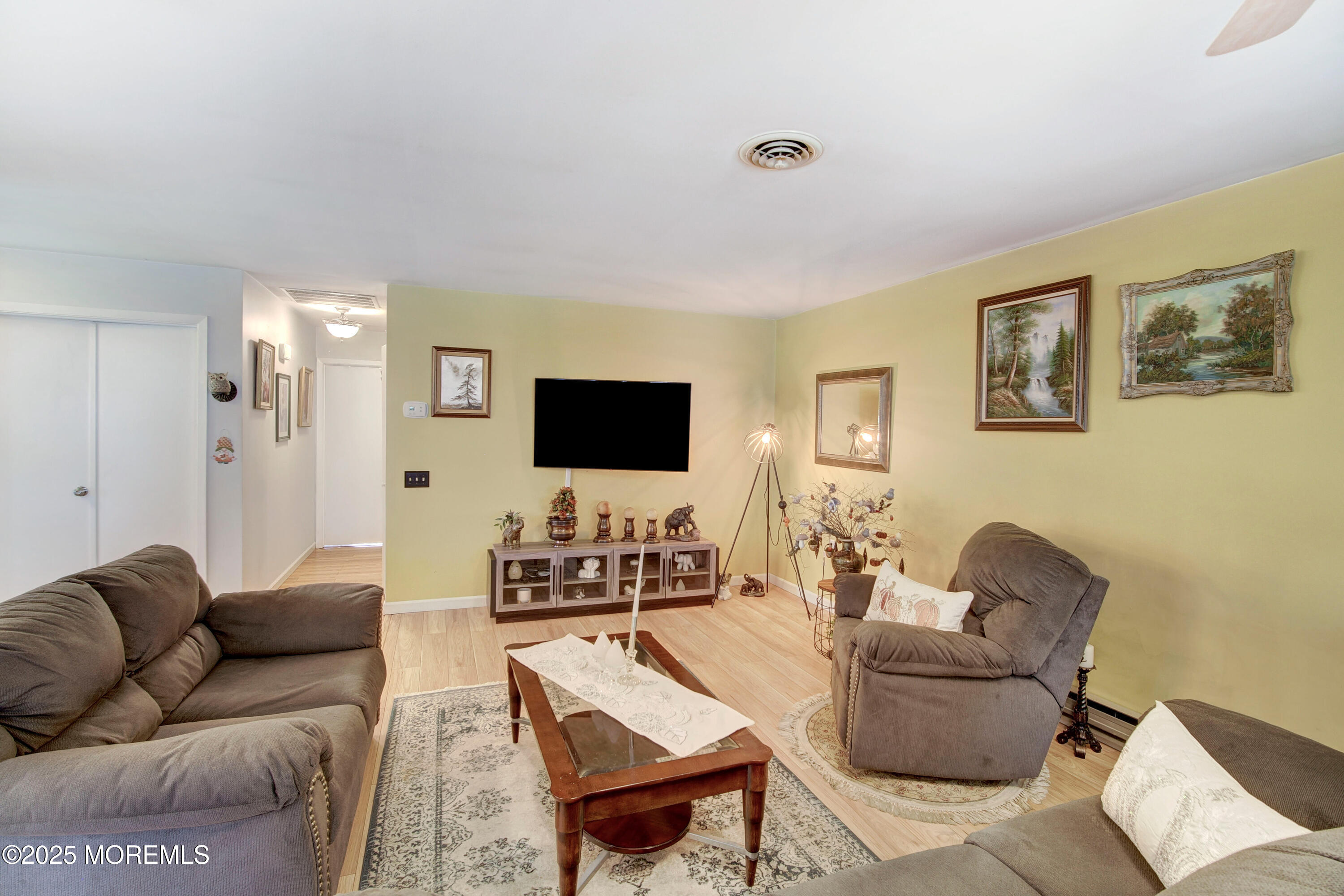 8B Alpine Road, Unit C Whiting, NJ 08759 - Photo 9 of 23 a living room with furniture and a flat screen tv