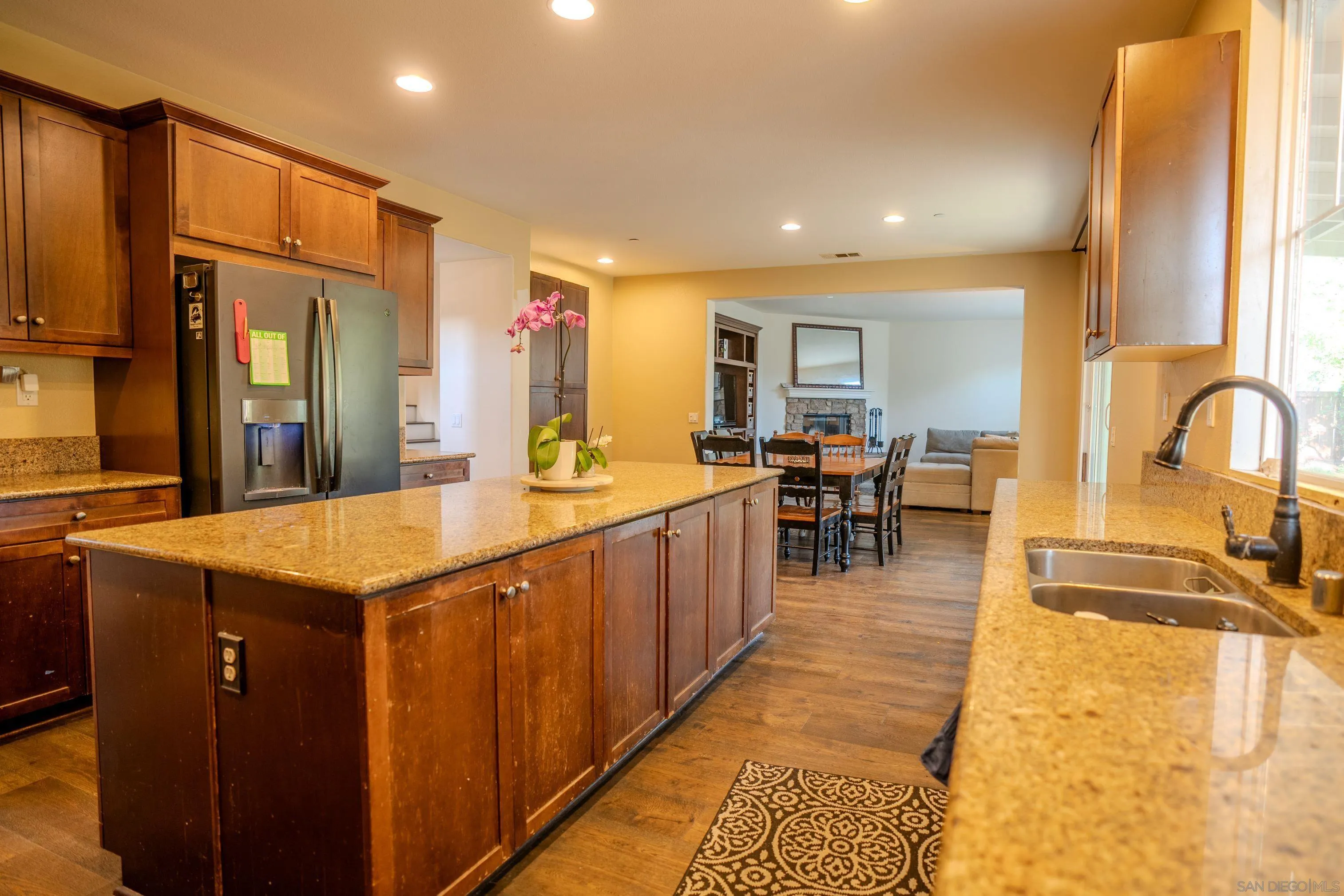 3283 Beven Drive Escondido, CA 92027 - Photo 14 of 64 a kitchen with kitchen island granite countertop a sink and counter space