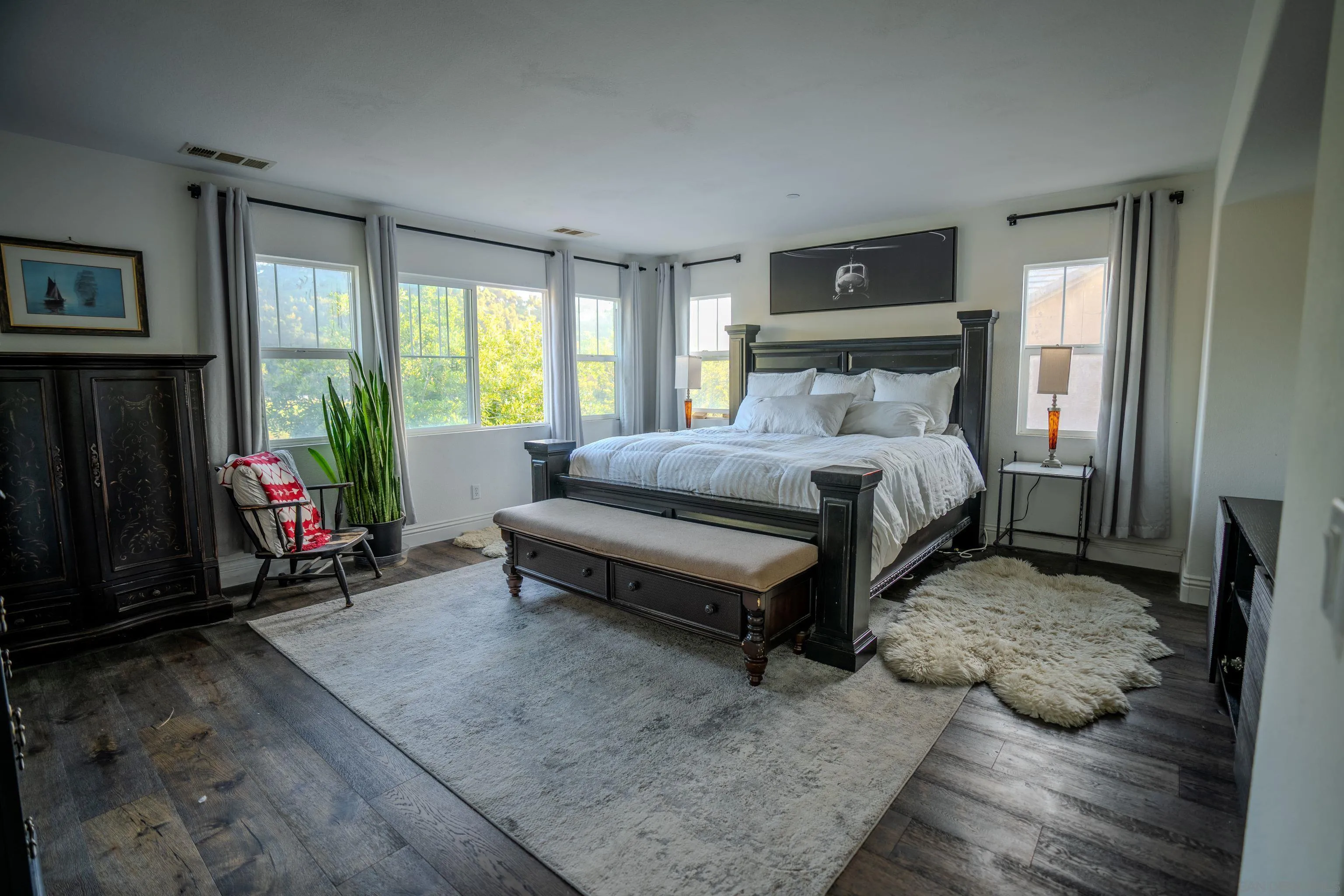 3283 Beven Drive Escondido, CA 92027 - Photo 22 of 64 a bedroom with a bed a large window with table and chair