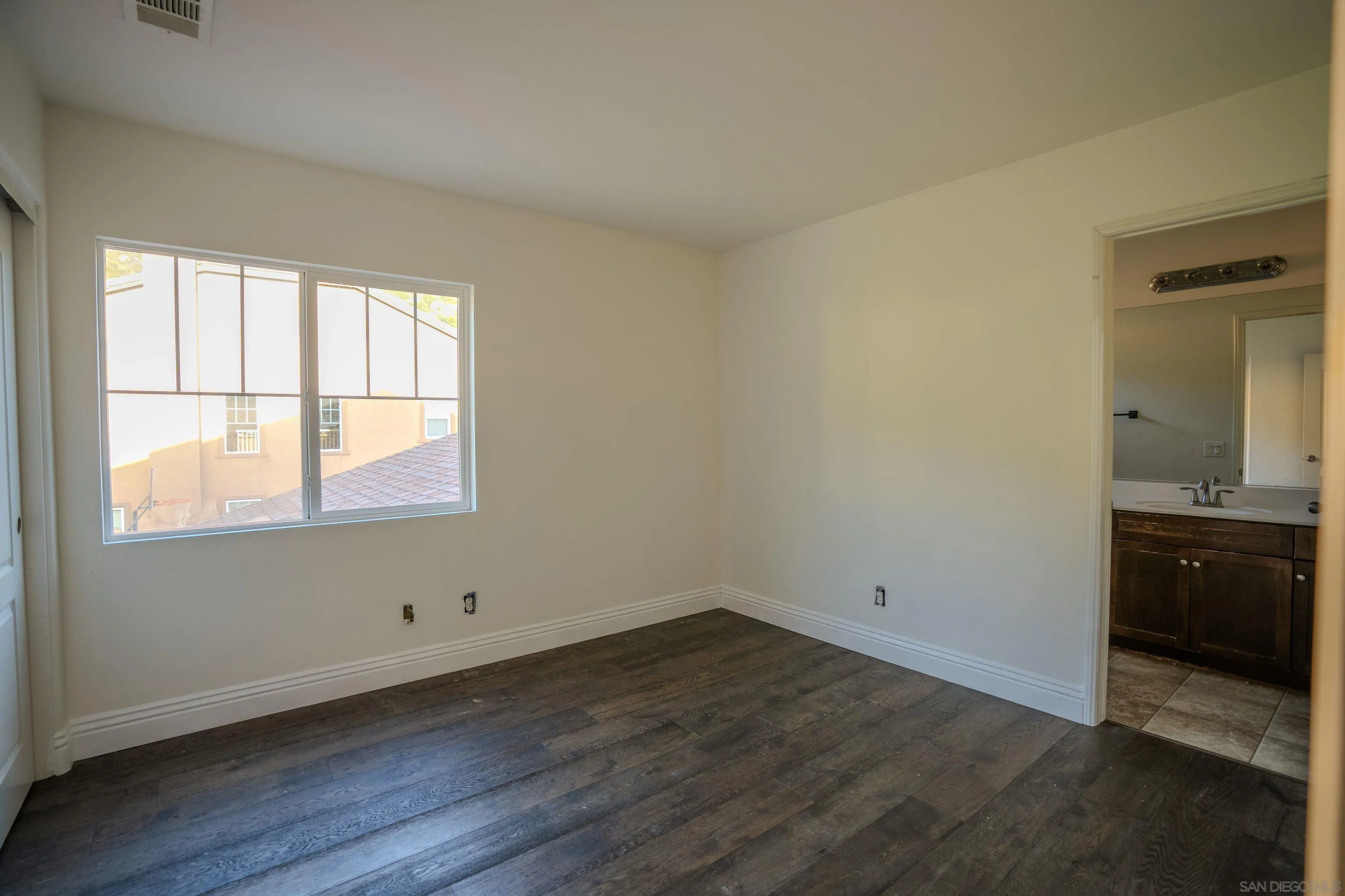 3283 Beven Drive Escondido, CA 92027 - Photo 34 of 64 an empty room with wooden floor and window