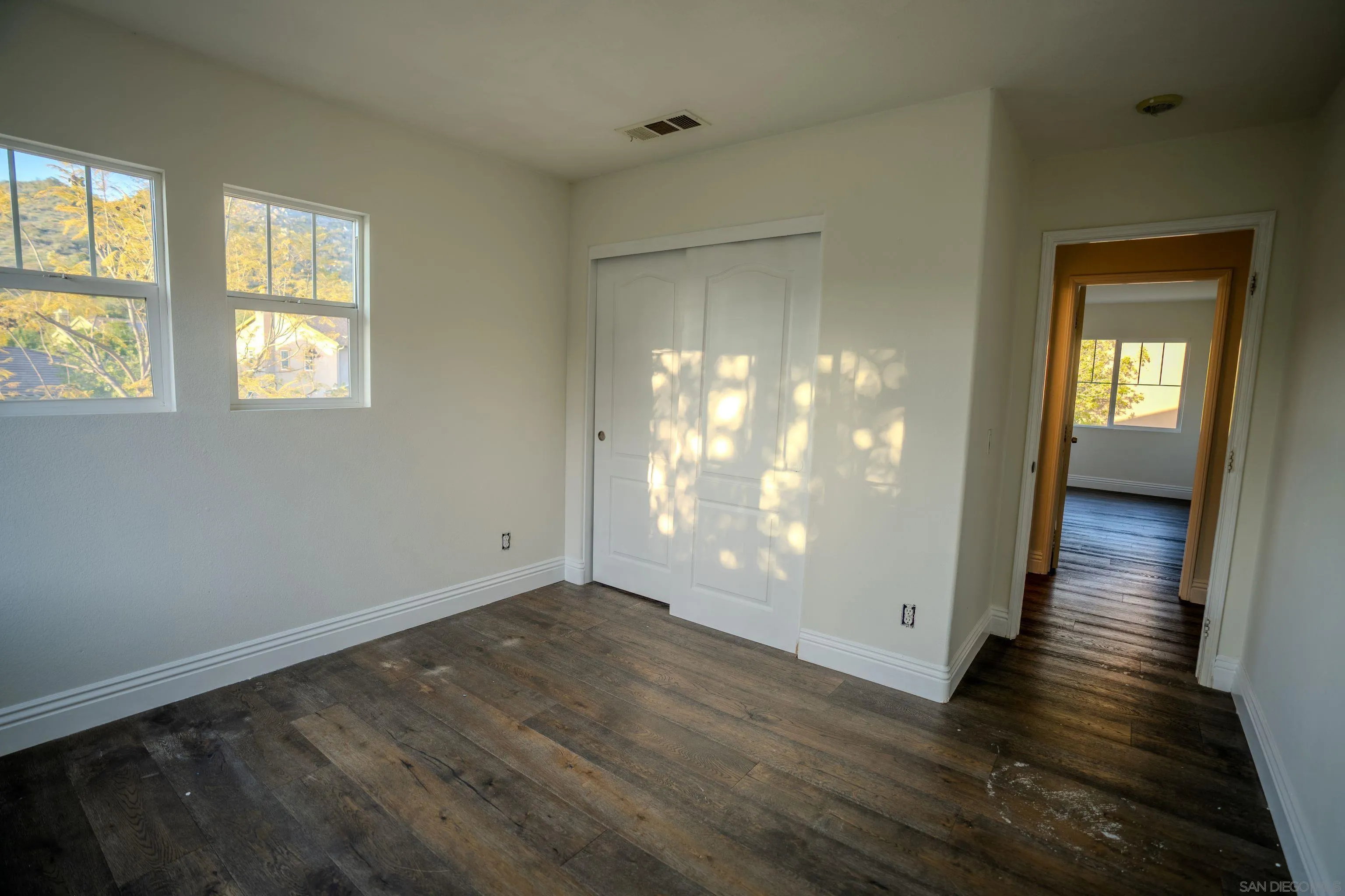 3283 Beven Drive Escondido, CA 92027 - Photo 37 of 64 a view of an empty room with wooden floor and a window