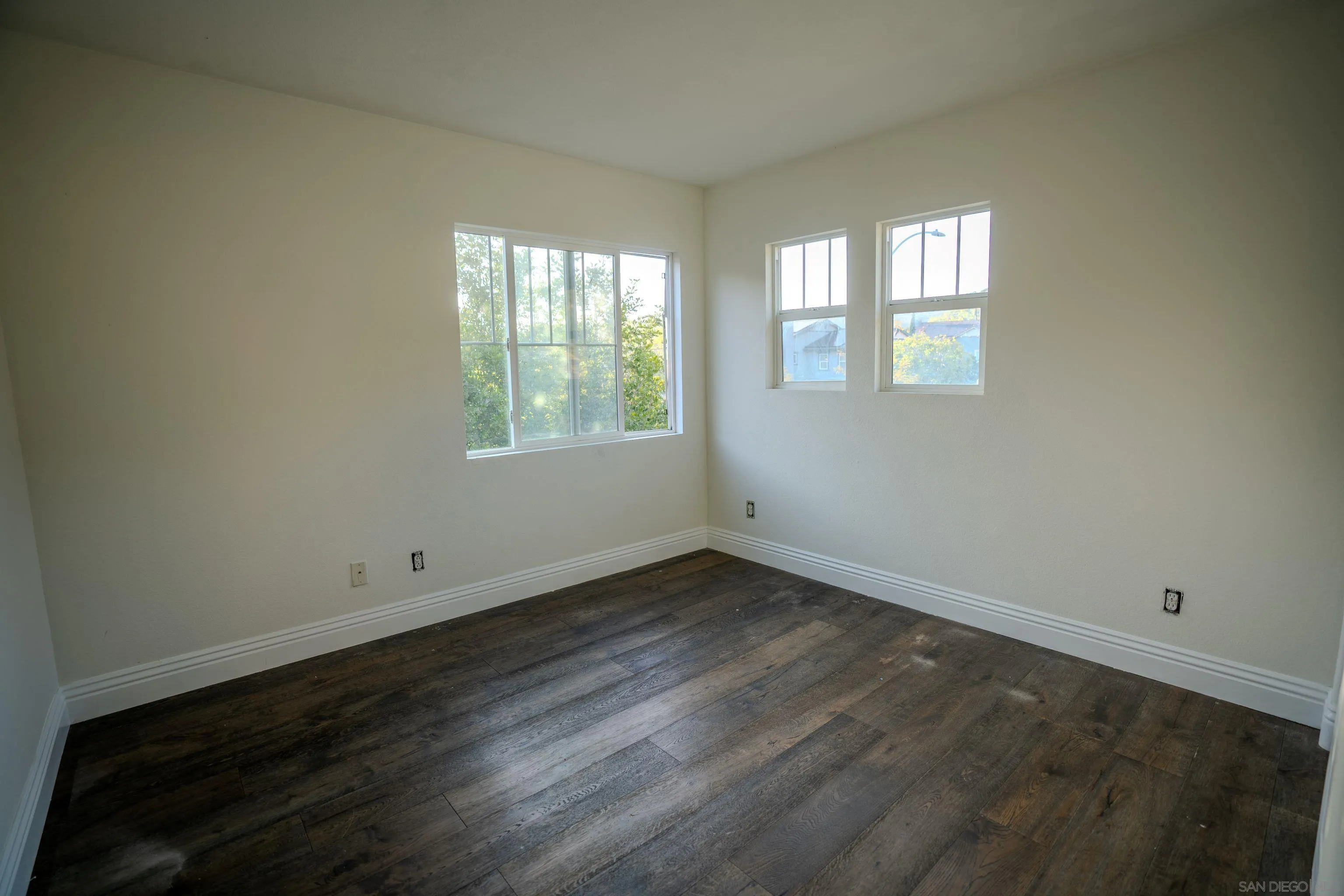 3283 Beven Drive Escondido, CA 92027 - Photo 38 of 64 an empty room with wooden floor and windows