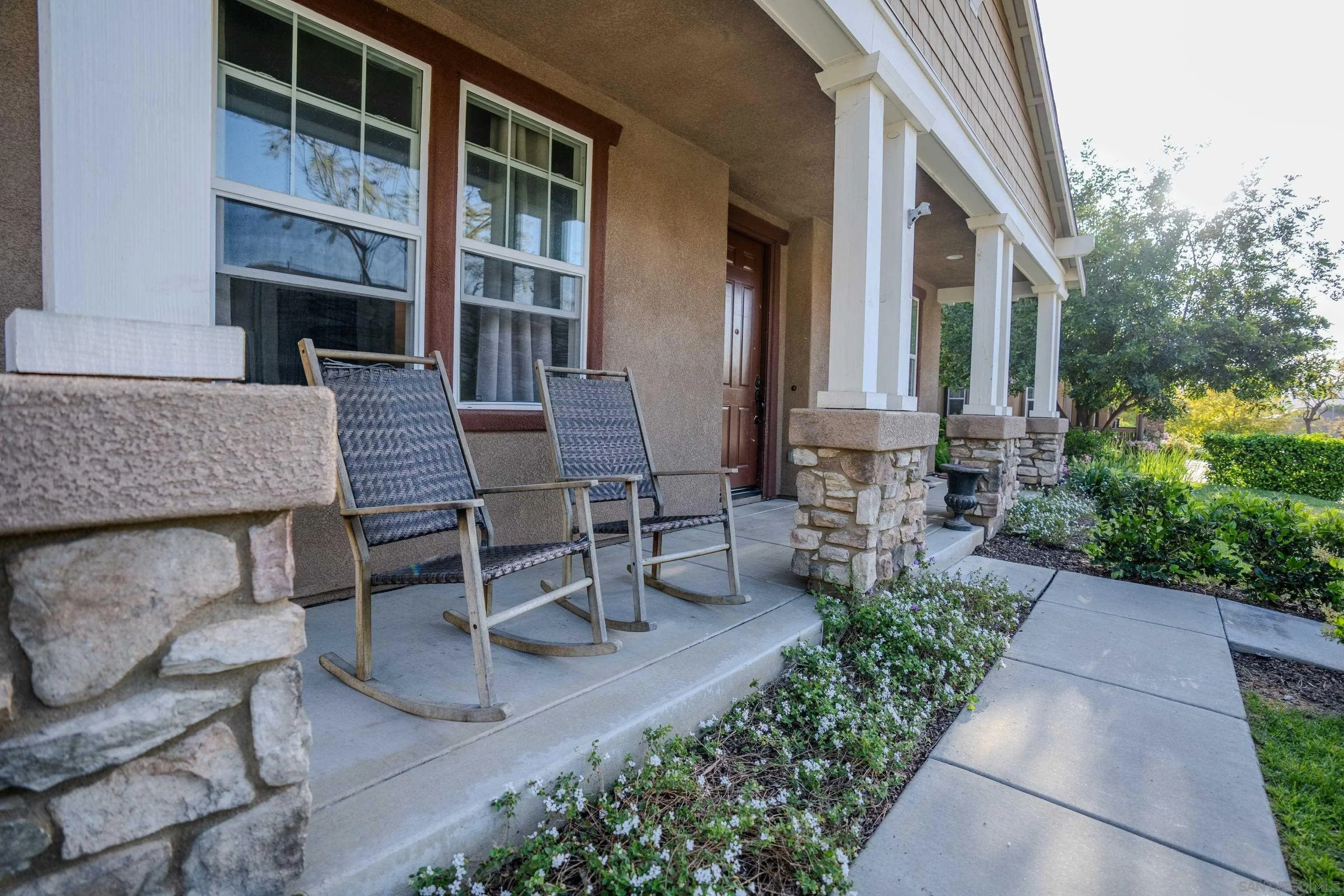 3283 Beven Drive Escondido, CA 92027 - Photo 4 of 64 a view of an outdoor sitting area with brick walls