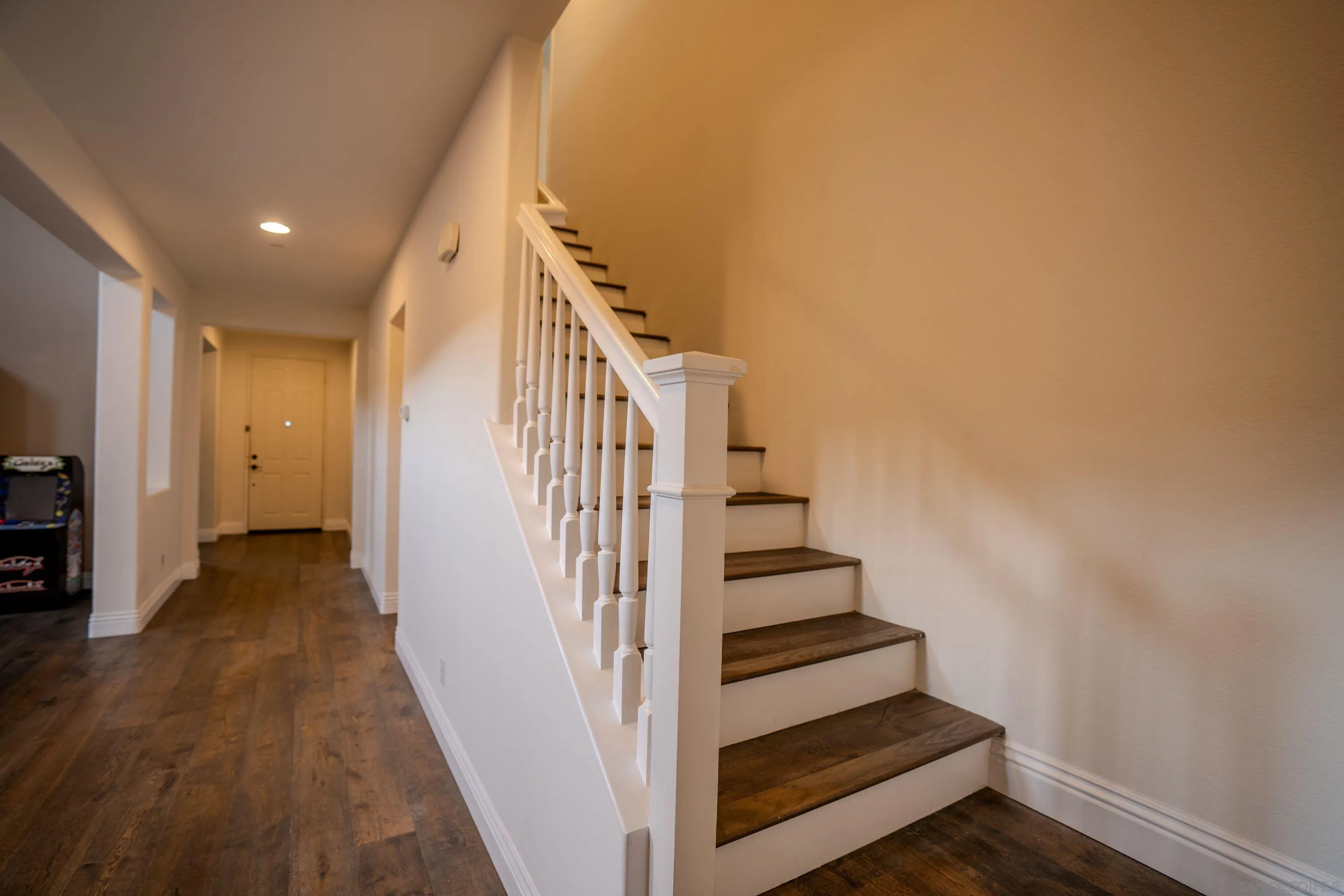 3283 Beven Drive Escondido, CA 92027 - Photo 43 of 64 a view of a hallway with wooden floor and entryway