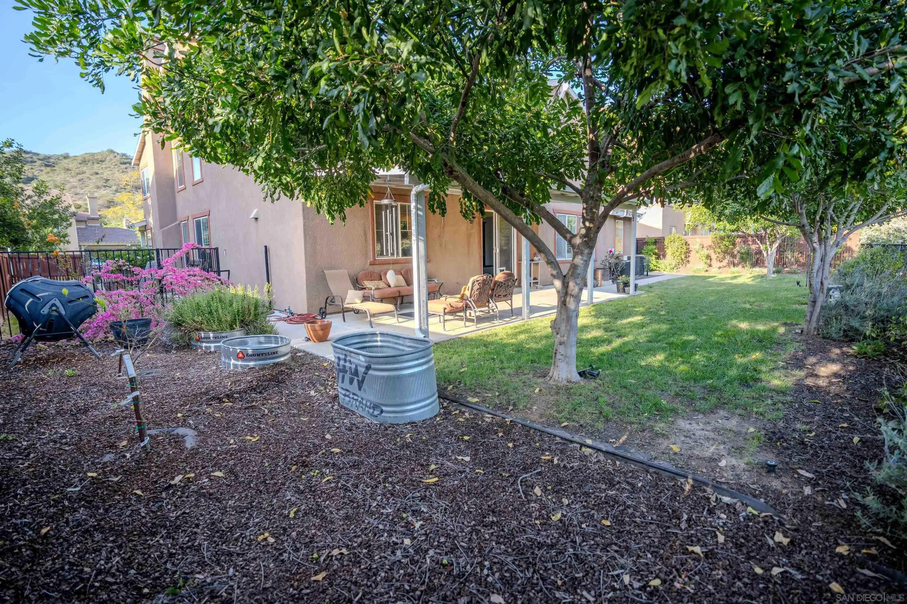 3283 Beven Drive Escondido, CA 92027 - Photo 50 of 64 a view of a house with backyard and sitting area