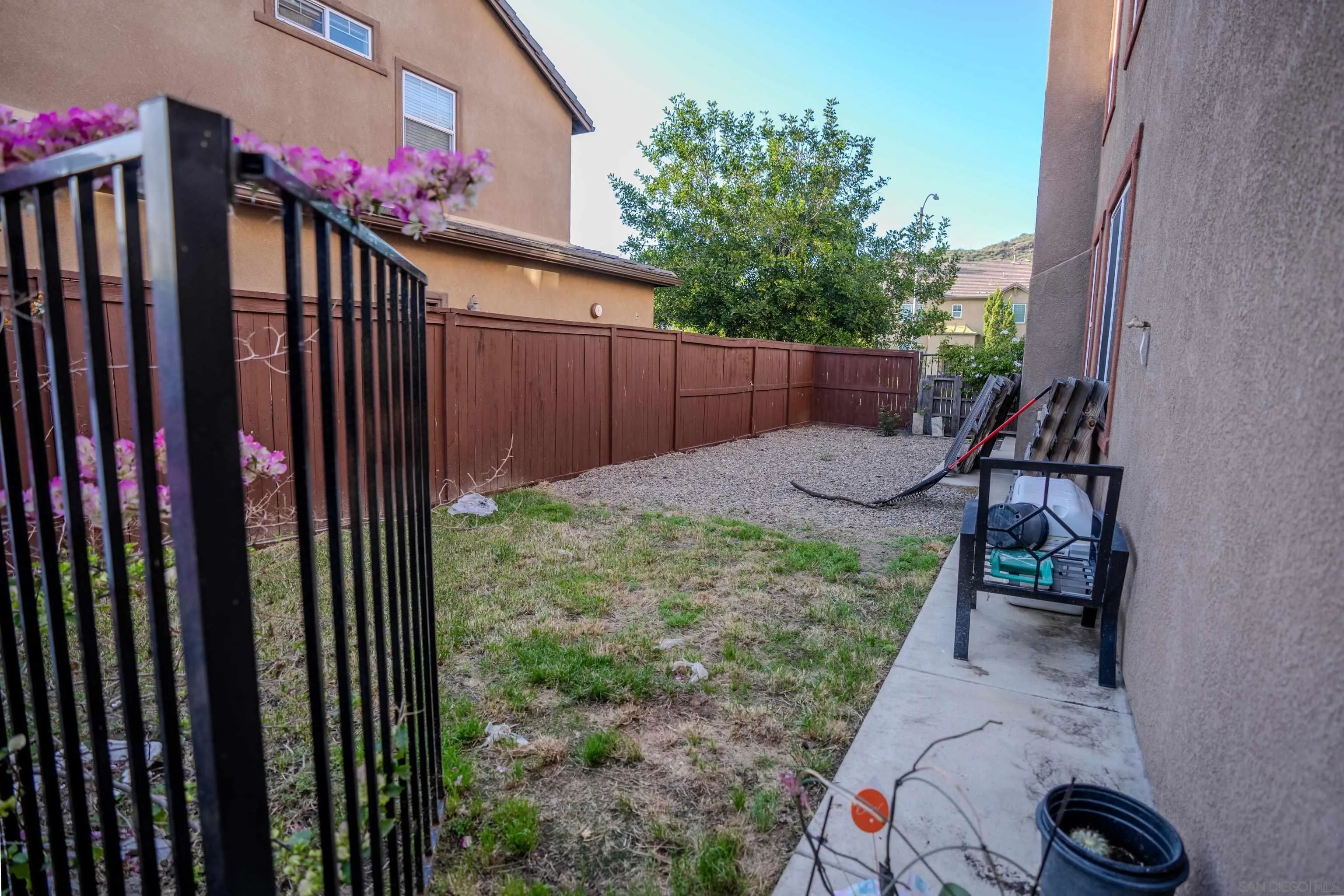 3283 Beven Drive Escondido, CA 92027 - Photo 52 of 64 a view of a backyard with plants and wooden fence