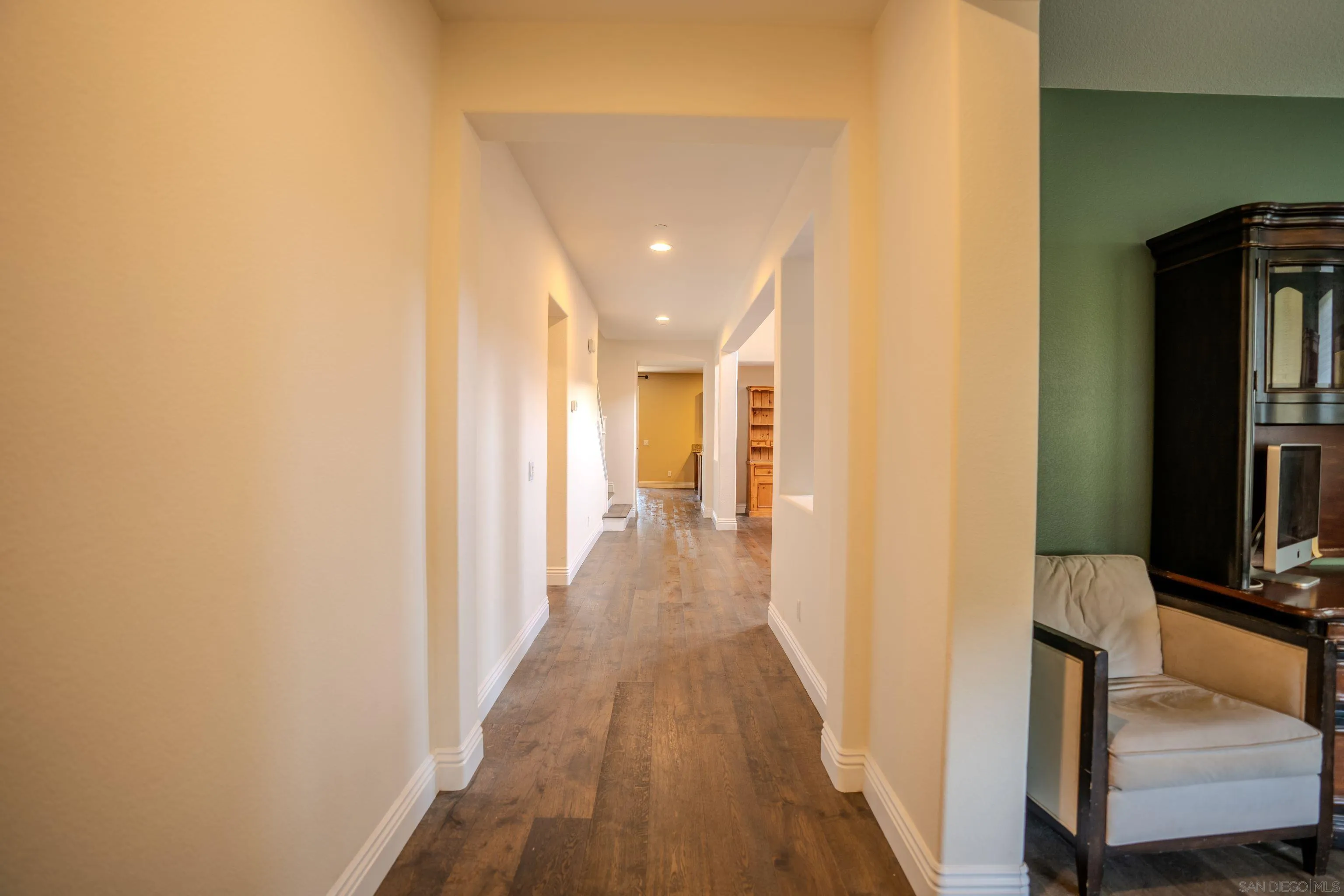 3283 Beven Drive Escondido, CA 92027 - Photo 7 of 64 a view of a hallway with wooden floor and staircase
