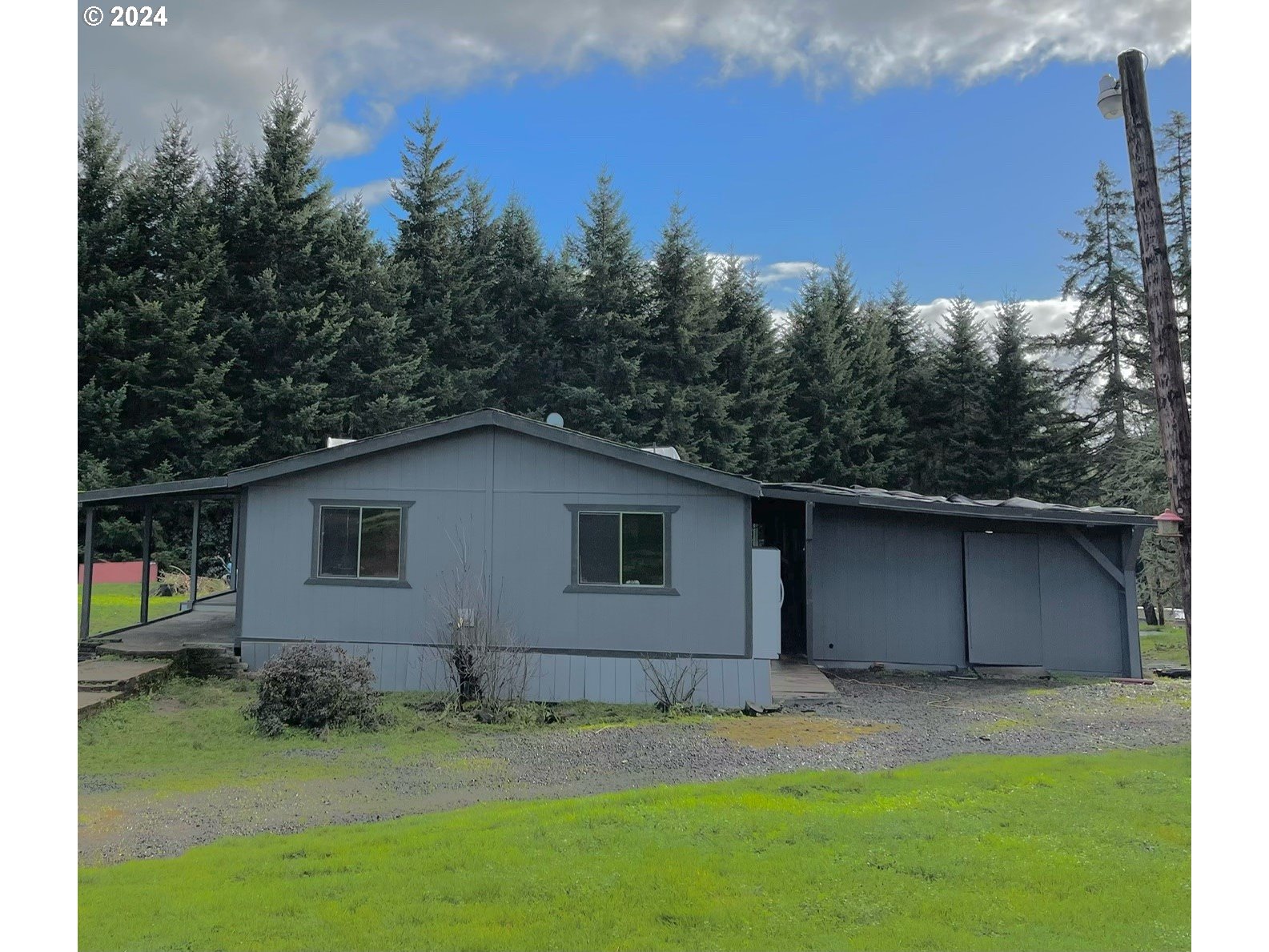 13900 Orchard Knob Road Dallas, OR 97338 - Photo 1 of 1 a house with trees in the background