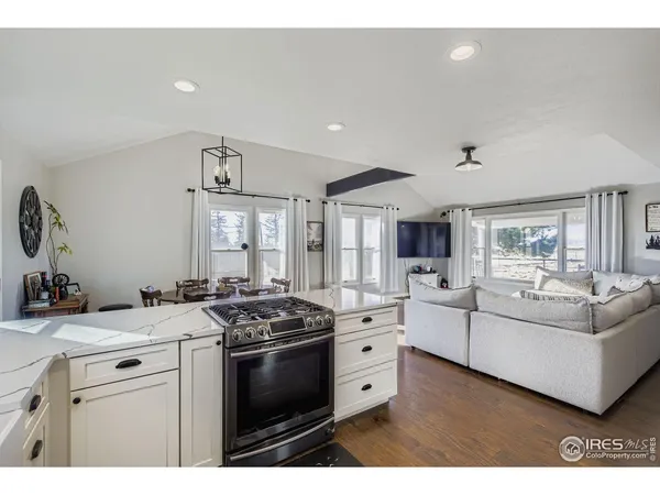 a view of living room with furniture and window