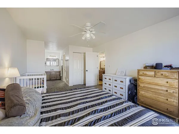 a bedroom with a bed and closet