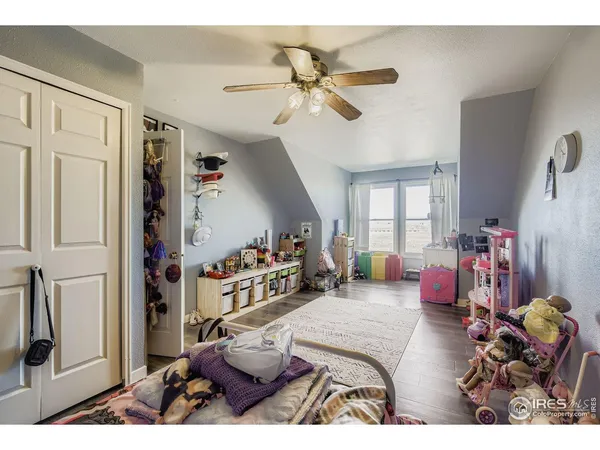 a bedroom with furniture and a chandelier