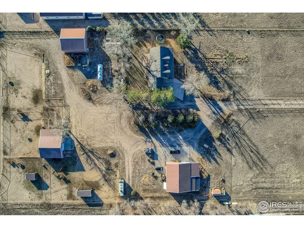 a bird view of house with a yard