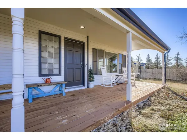 a bedroom with a bed and glass door