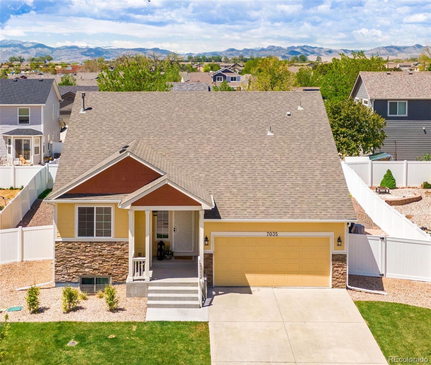 7035 McClellan Road Wellington, CO 80549 - Photo 19 of 43 front view of a house with a yard