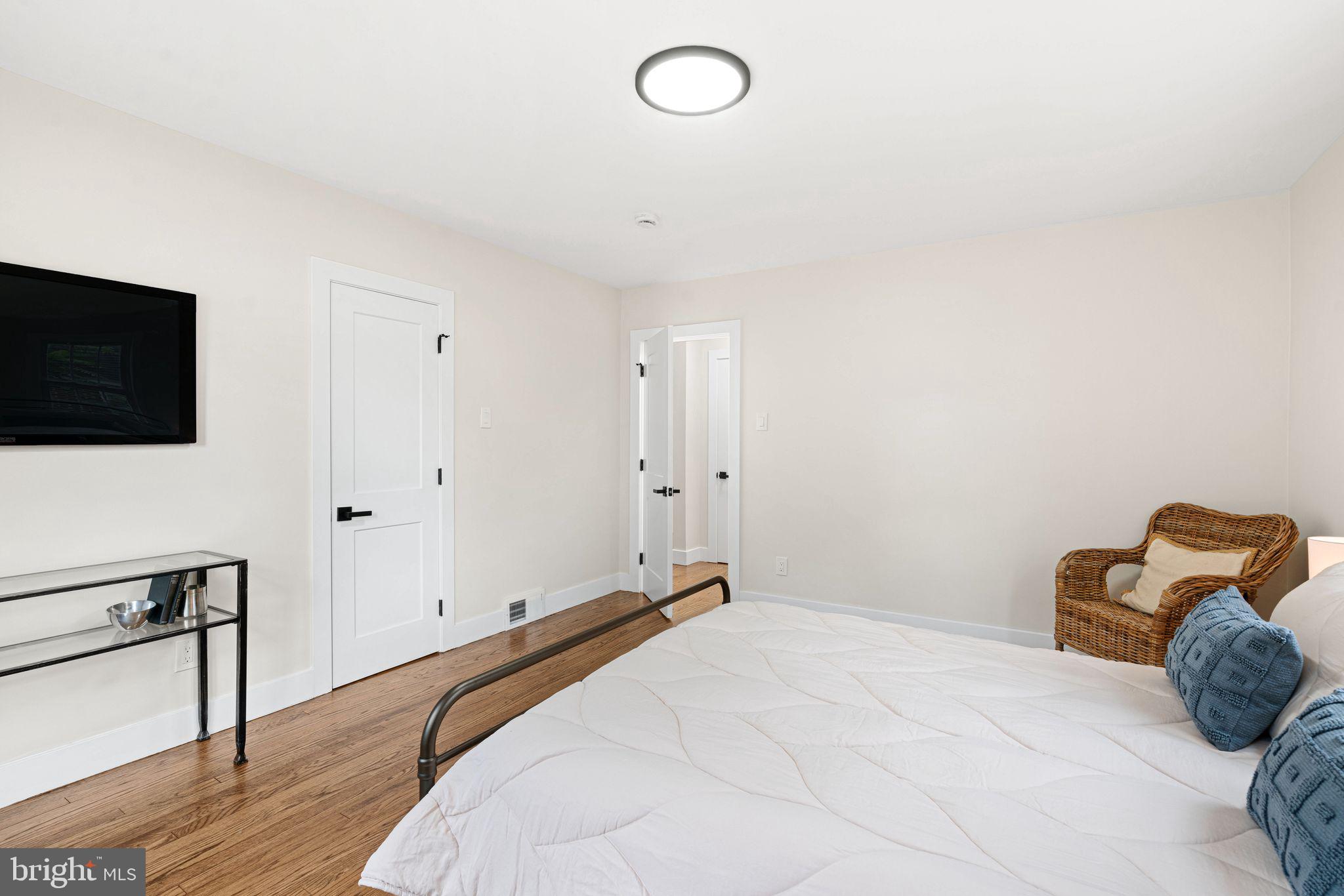 116 Rhoads Avenue Haddonfield, NJ 08033 - Photo 14 of 29 a bedroom with a bed and a flat screen tv