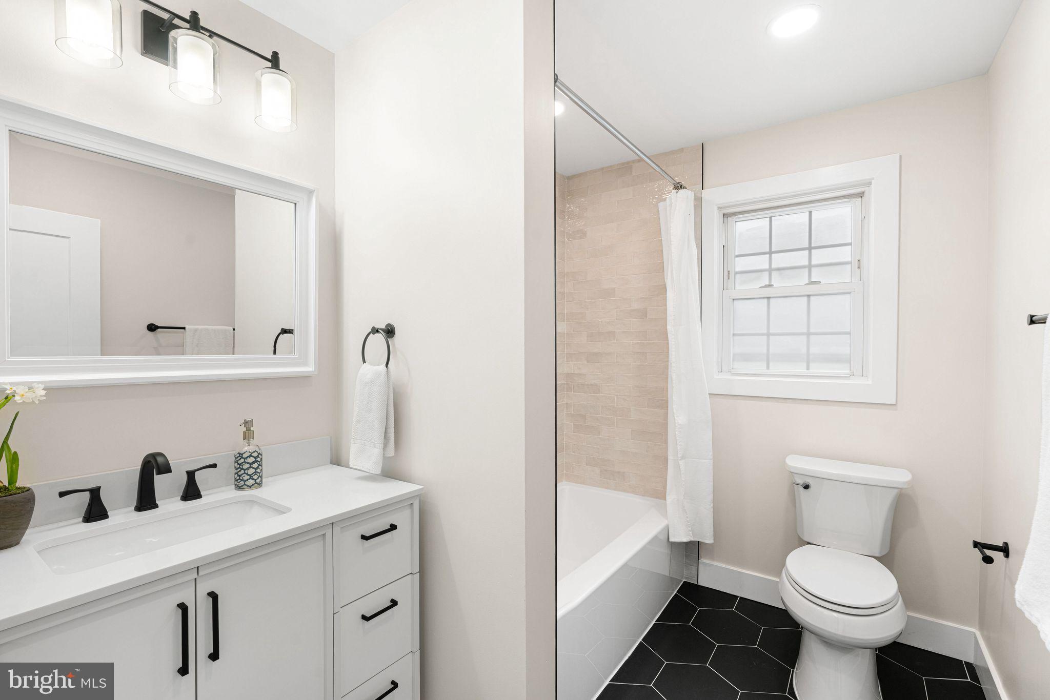 116 Rhoads Avenue Haddonfield, NJ 08033 - Photo 15 of 29 a bathroom with a sink toilet vanity and tub