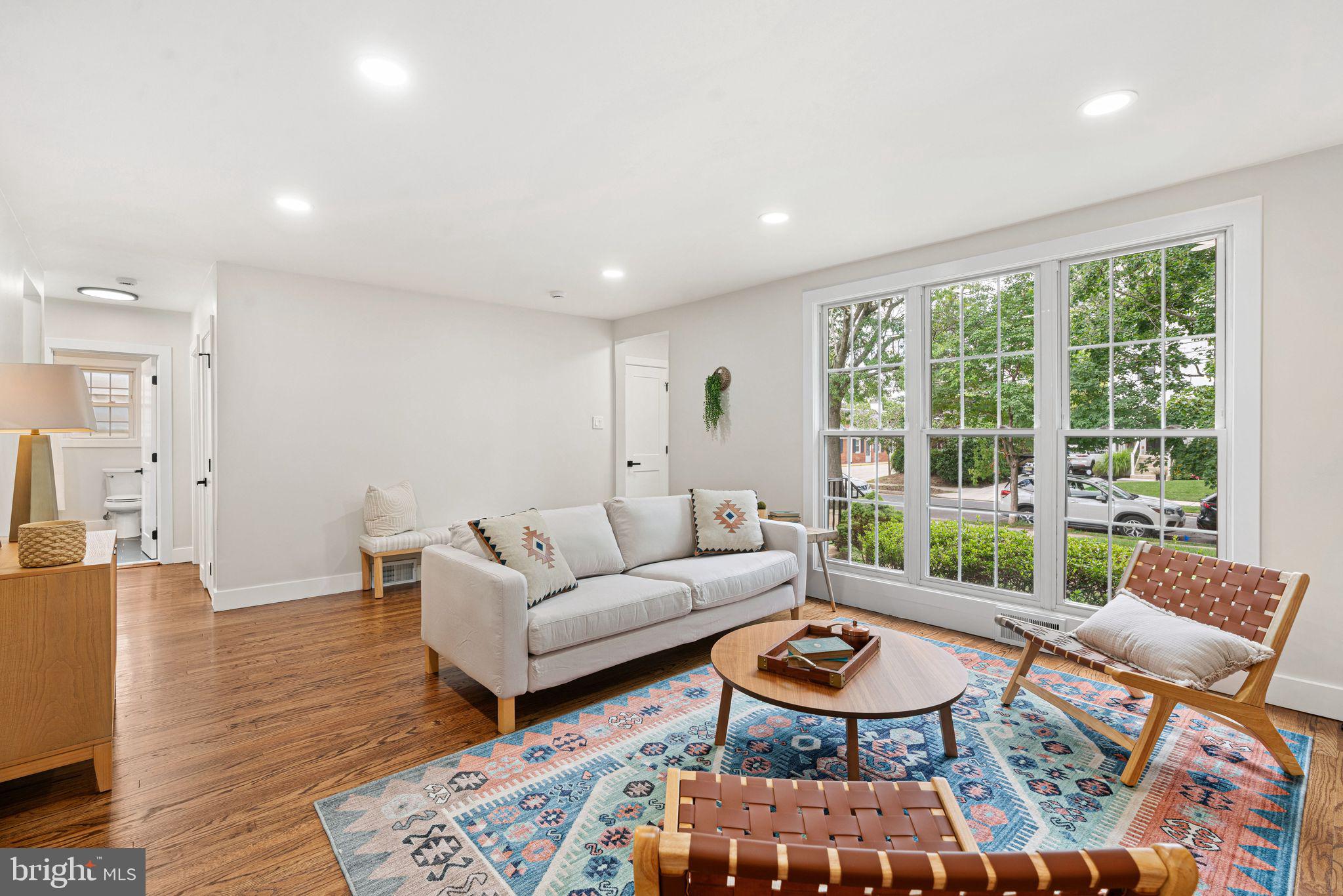 116 Rhoads Avenue Haddonfield, NJ 08033 - Photo 2 of 29 a living room with furniture a rug and a large window