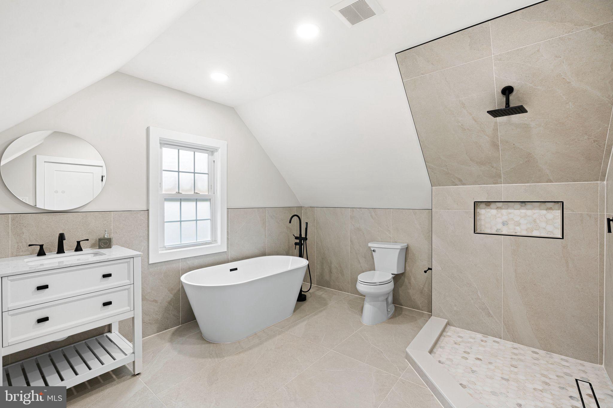 116 Rhoads Avenue Haddonfield, NJ 08033 - Photo 21 of 29 a bathroom with a double vanity sink a toilet and a bathtub