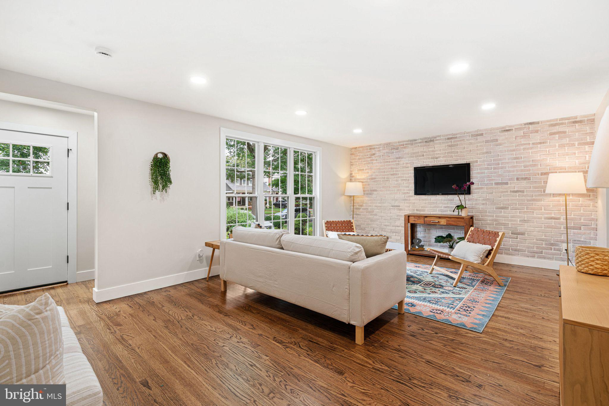 116 Rhoads Avenue Haddonfield, NJ 08033 - Photo 3 of 29 a living room with furniture and a flat screen tv