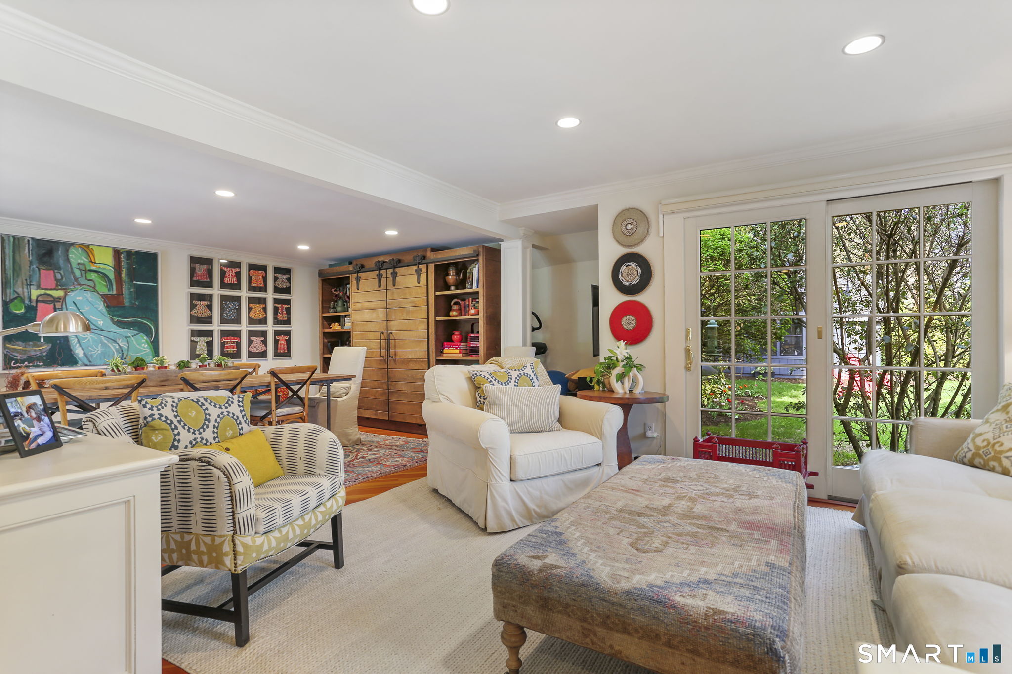 29 Old Saugatuck Road Norwalk, CT 06855 - Photo 14 of 34 a living room with furniture and a floor to ceiling window