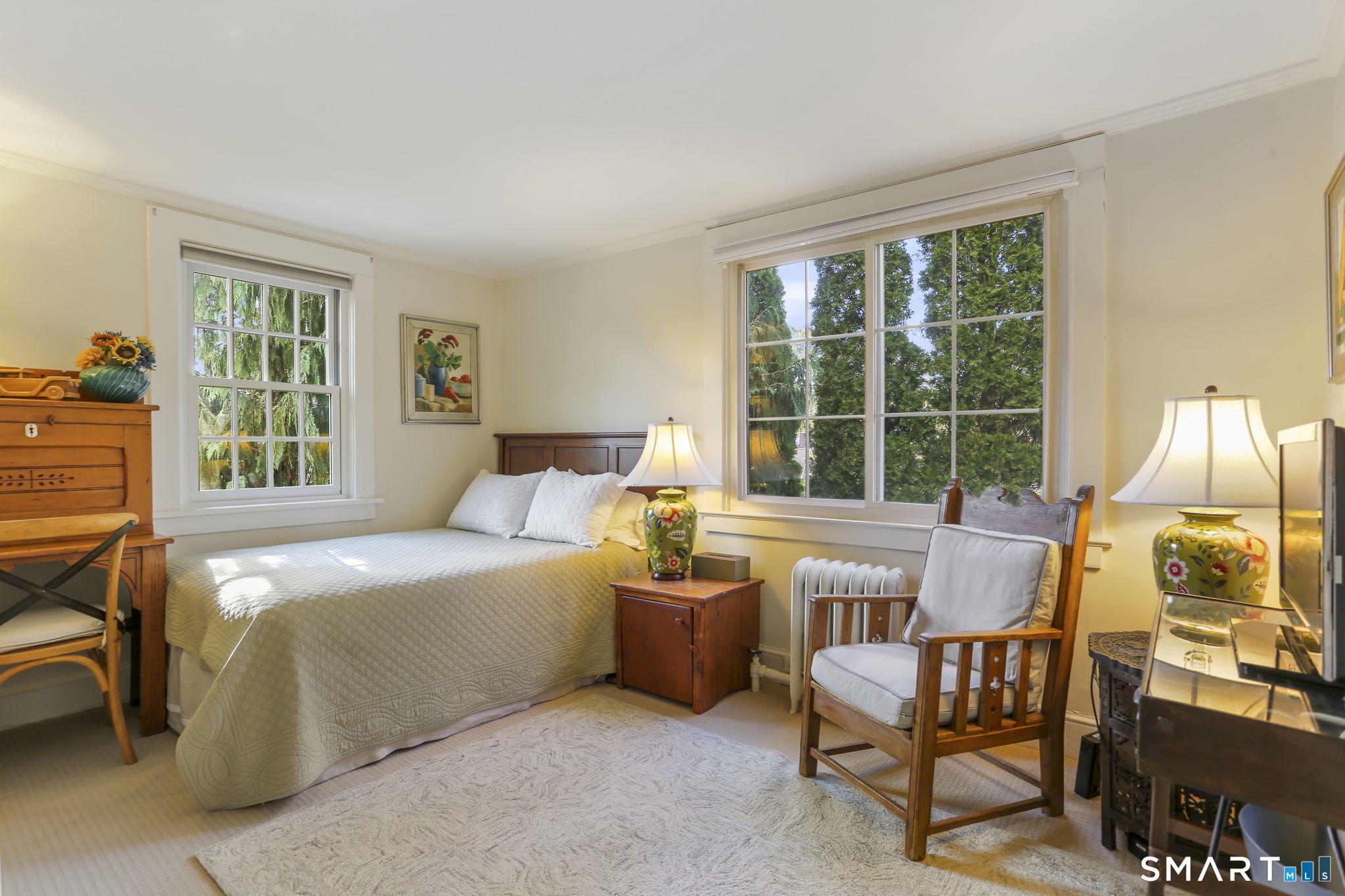 29 Old Saugatuck Road Norwalk, CT 06855 - Photo 20 of 34 a bedroom with a bed and large windows