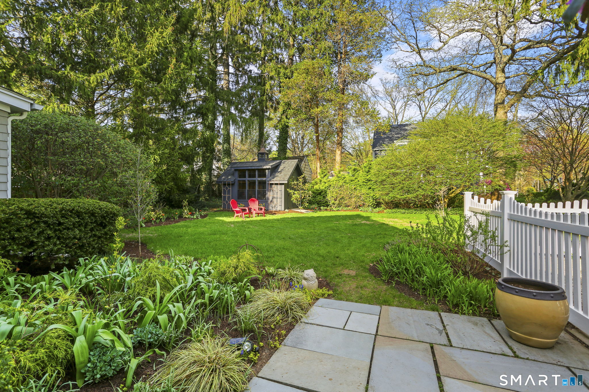 29 Old Saugatuck Road Norwalk, CT 06855 - Photo 27 of 34 a view of a garden with plants and large trees