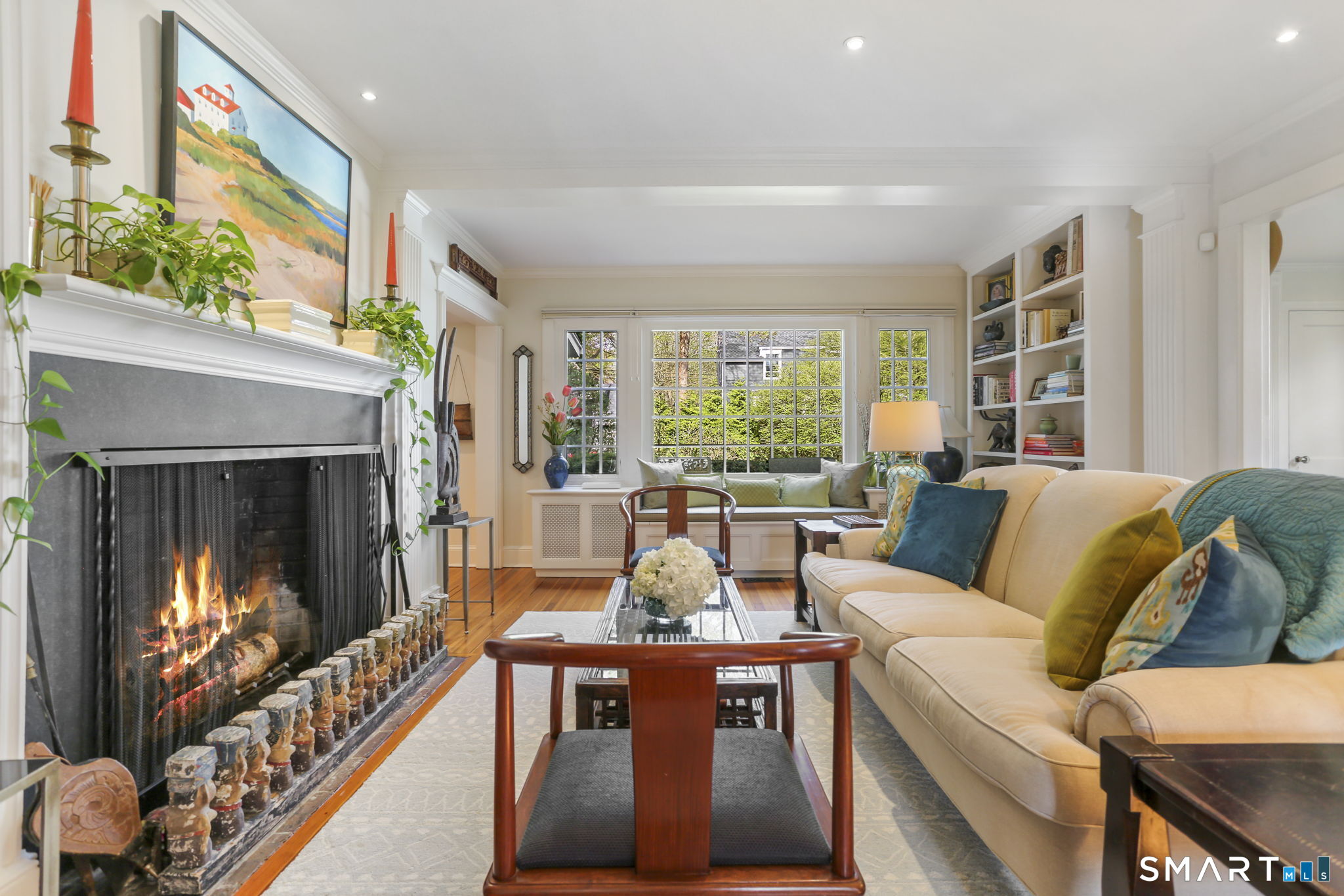 29 Old Saugatuck Road Norwalk, CT 06855 - Photo 8 of 34 a living room with furniture large window and a fireplace