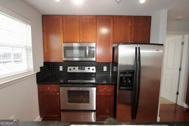 a kitchen with a stove and a microwave
