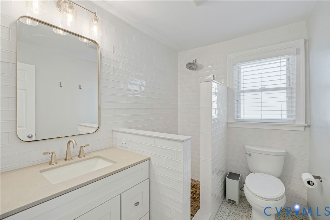 701 Rothesay Road Richmond, VA 23221 - Photo 30 of 38 Renovated bath on 2nd floor with floor-to-ceiling