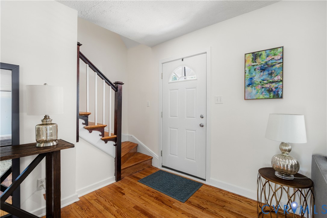 701 Rothesay Road Richmond, VA 23221 - Photo 4 of 38 New front door with half circle window opens into