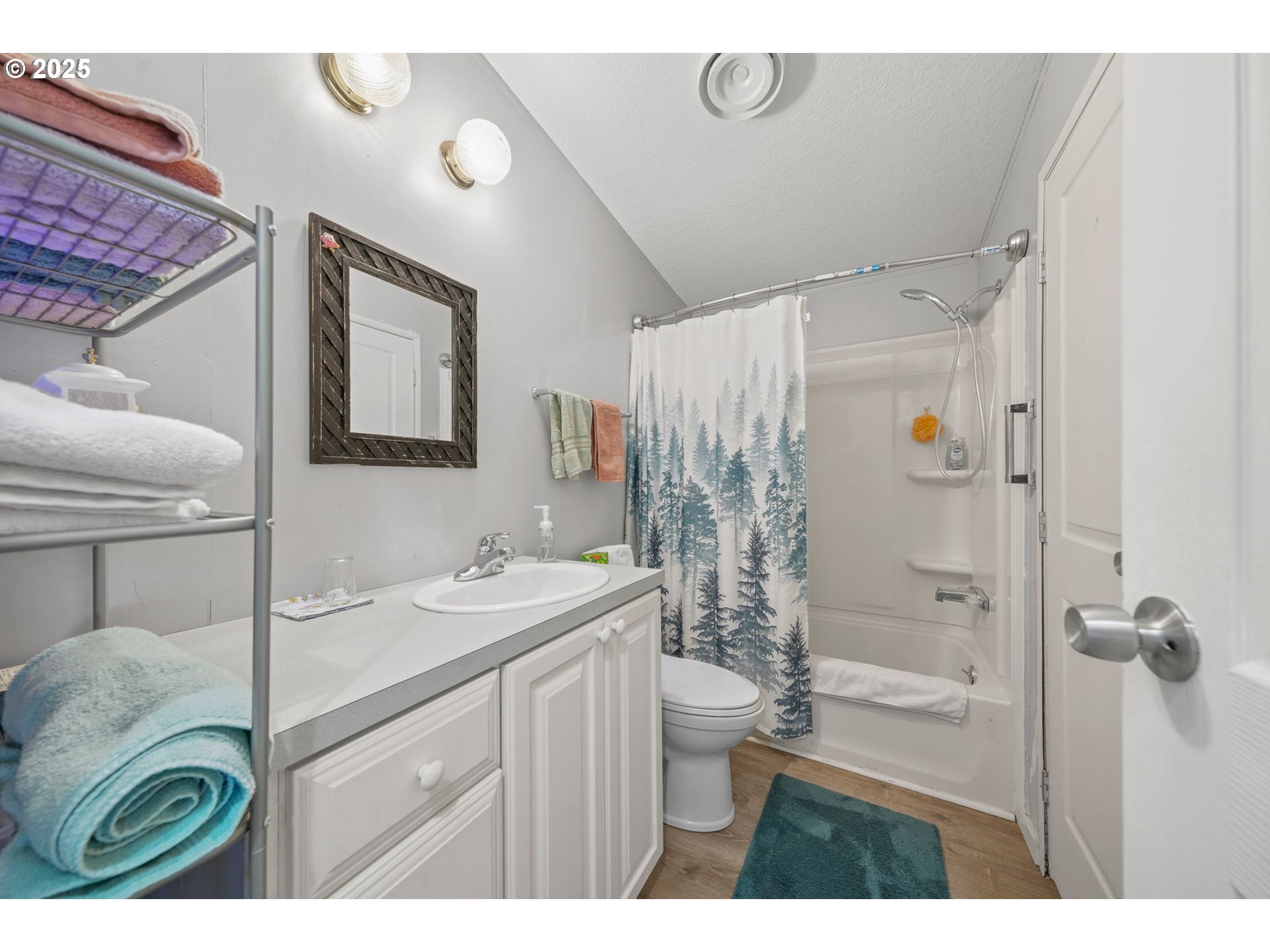 39098 Dexter Road, Unit 8A Dexter, OR 97431 - Photo 13 of 22 a bathroom with a sink a toilet a shower and a mirror