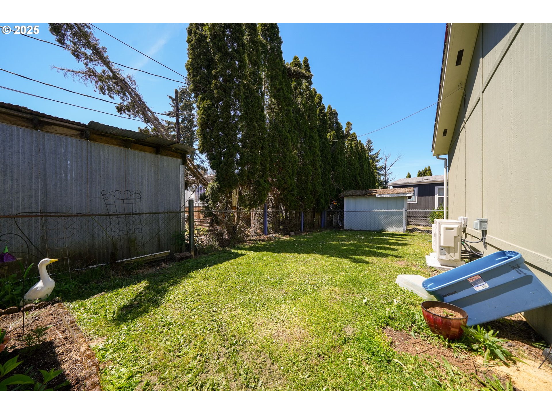 39098 Dexter Road, Unit 8A Dexter, OR 97431 - Photo 21 of 22 a backyard of a house with yard and outdoor seating