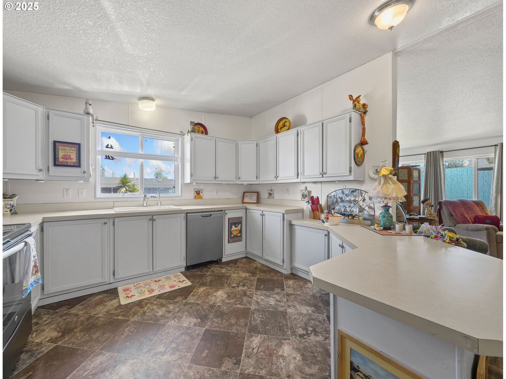 39098 Dexter Road, Unit 8A Dexter, OR 97431 - Photo 8 of 22 a kitchen with a sink a stove cabinets and counter space
