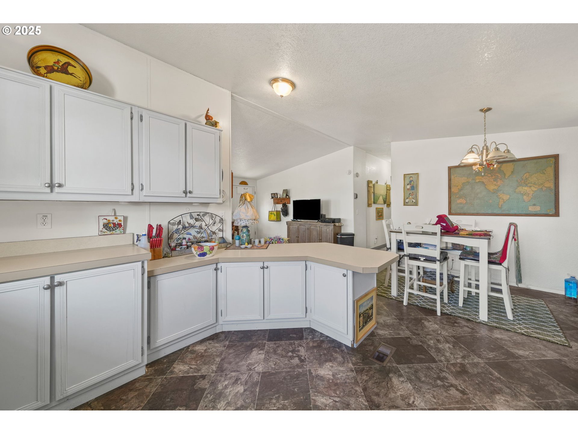 39098 Dexter Road, Unit 8A Dexter, OR 97431 - Photo 10 of 22 a kitchen with cabinets and chairs