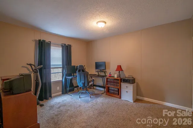 a view of a workspace with furniture