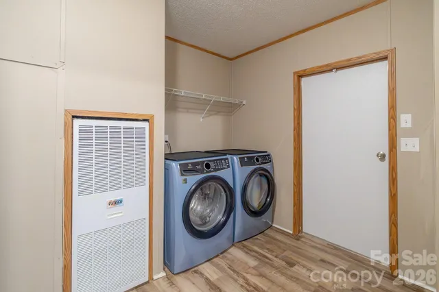 a view of storage and utility room with washer and dryer