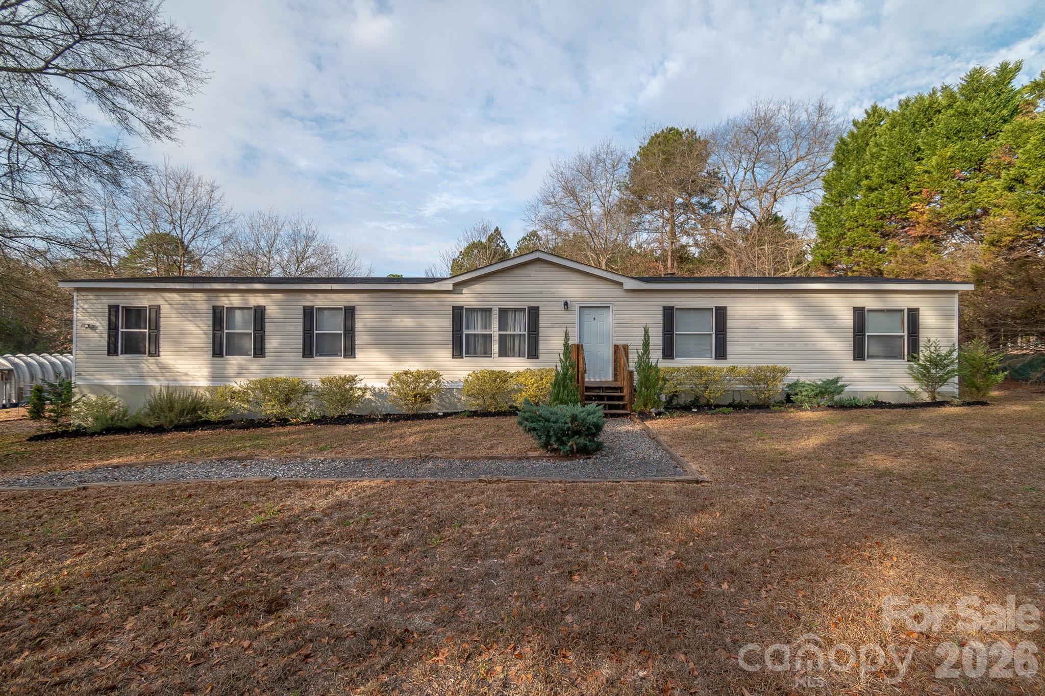 6706 Patrick Highway Patrick, SC 29584 - Photo 2 of 43 front view of a house with a patio