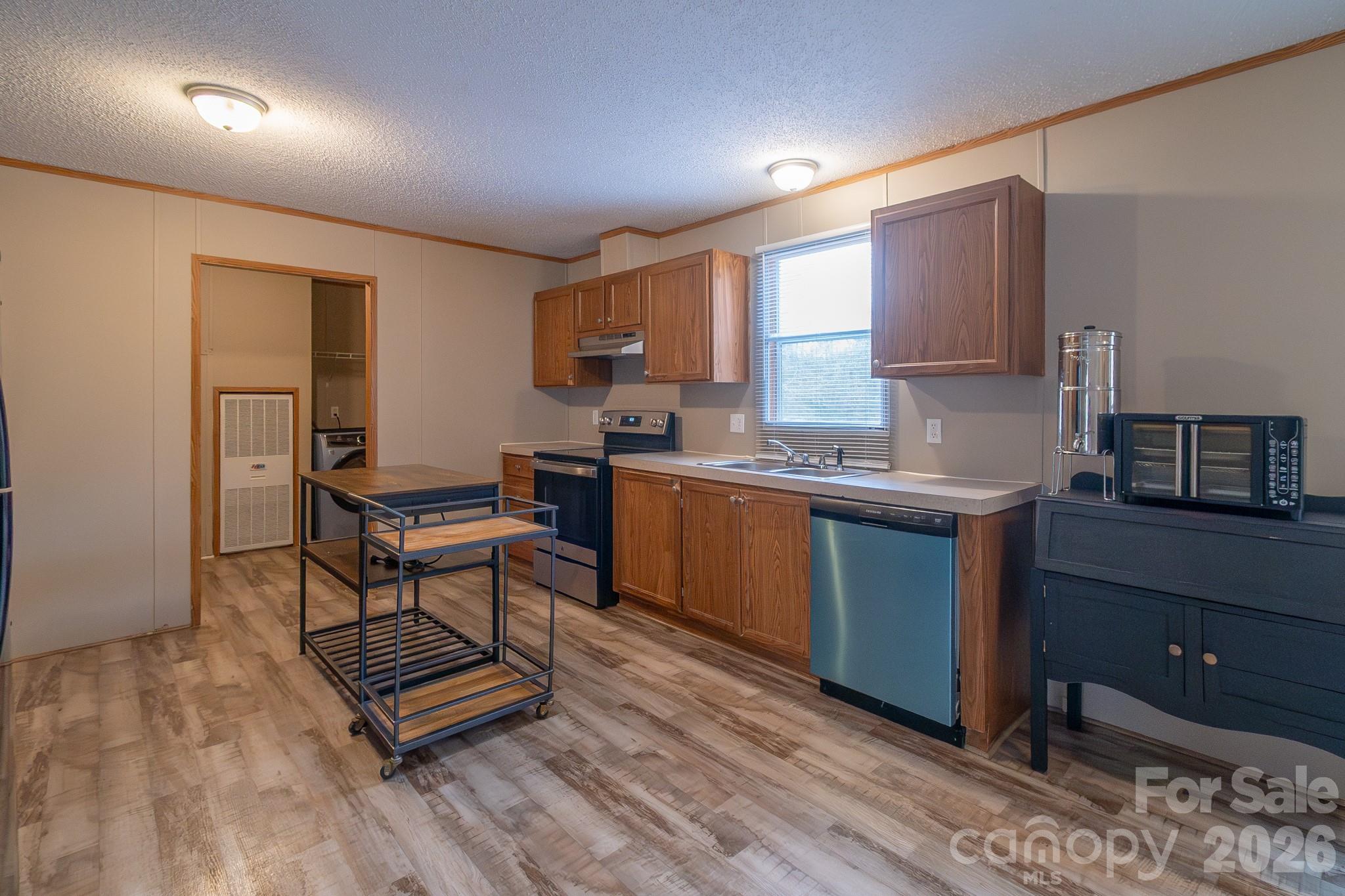 6706 Patrick Highway Patrick, SC 29584 - Photo 24 of 43 a kitchen with a sink a counter space and a window
