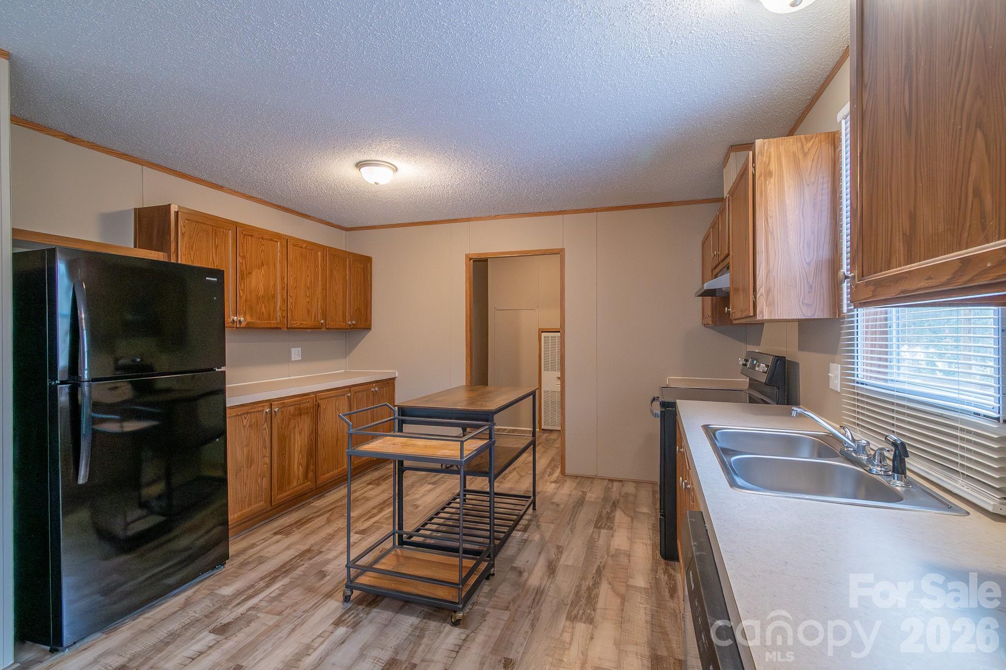 6706 Patrick Highway Patrick, SC 29584 - Photo 26 of 43 a kitchen with stainless steel appliances granite countertop a refrigerator sink and stove