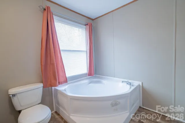 a bathroom with a sink a toilet and tub